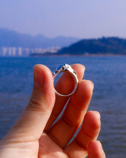 four stars sterling silver ring with a red garnet