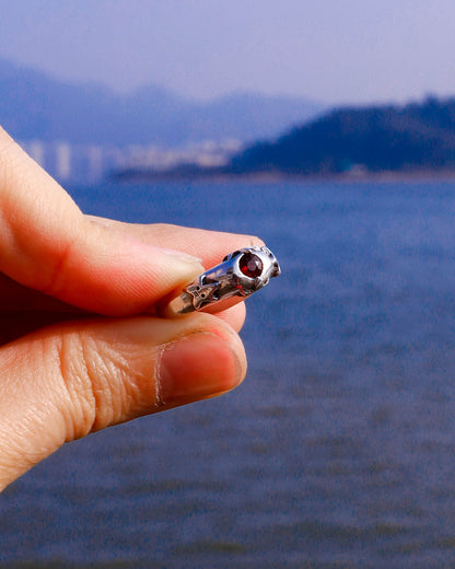 four stars sterling silver ring with a red garnet stone