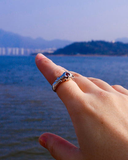 four stars sterling silver ring with a red garnet stone