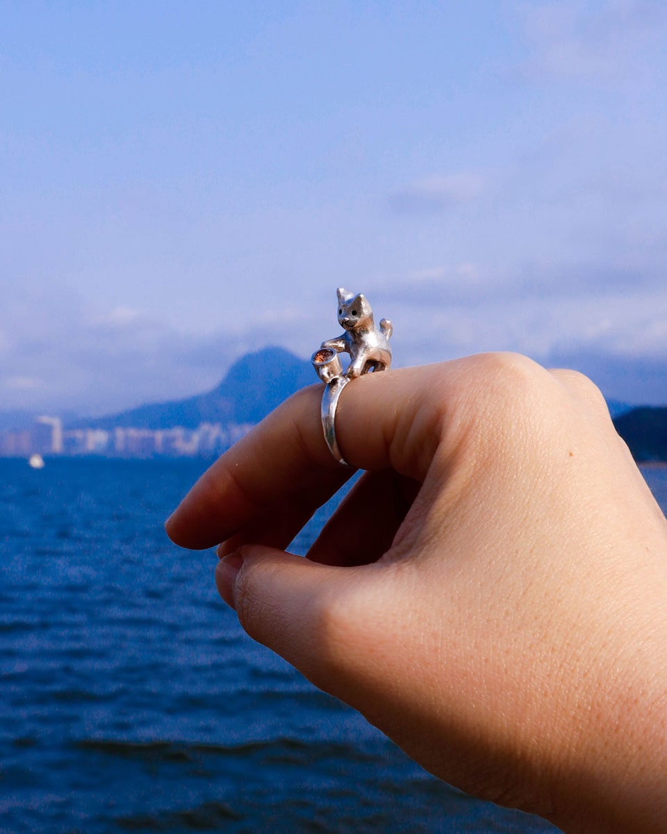 naughty kitty sterling silver ring, cat pushing cup off table, handmade jewellery, by fake plastic love