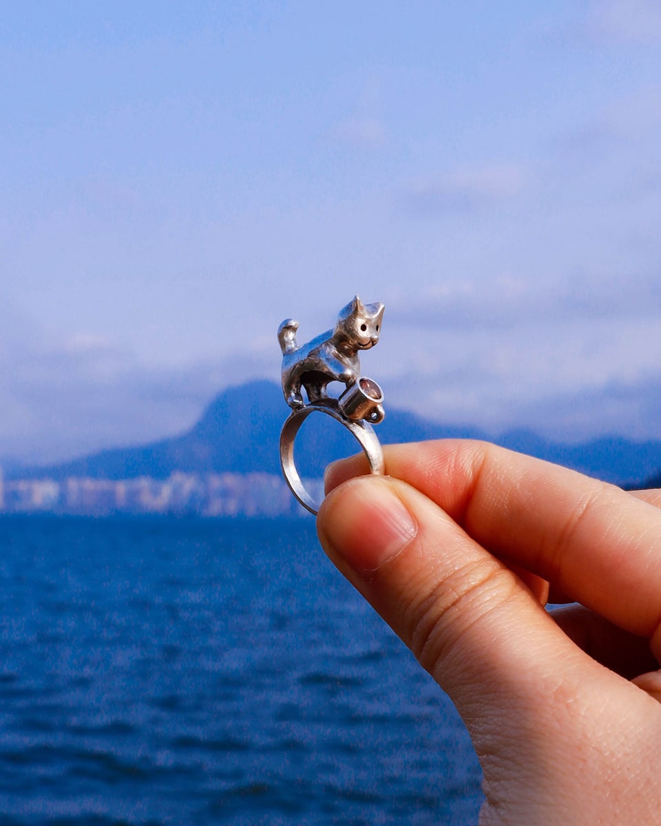 naughty kitty sterling silver ring, cat pushing cup off table, handmade jewellery, by fake plastic love