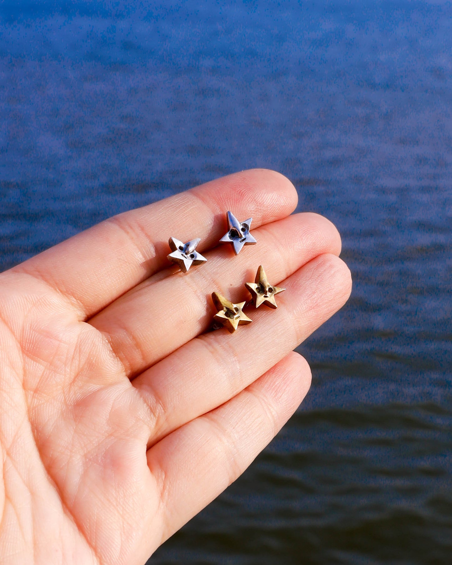 Tiny star face studs earrings, in sterling silver and brass