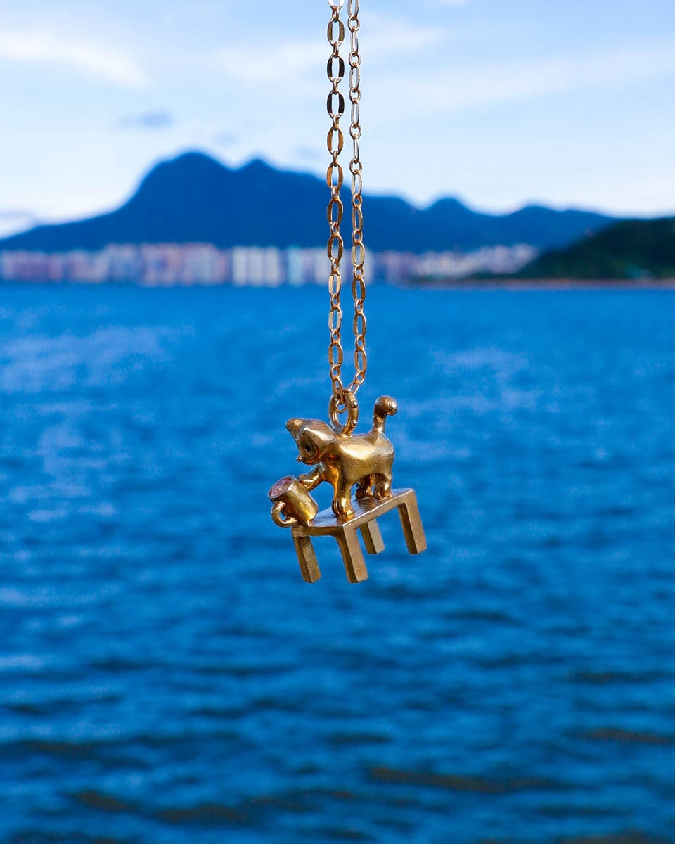 solid brass naughty kitty charm, cat pushing cup off table, set with cz stone, handmade jewellery, by fake plastic love