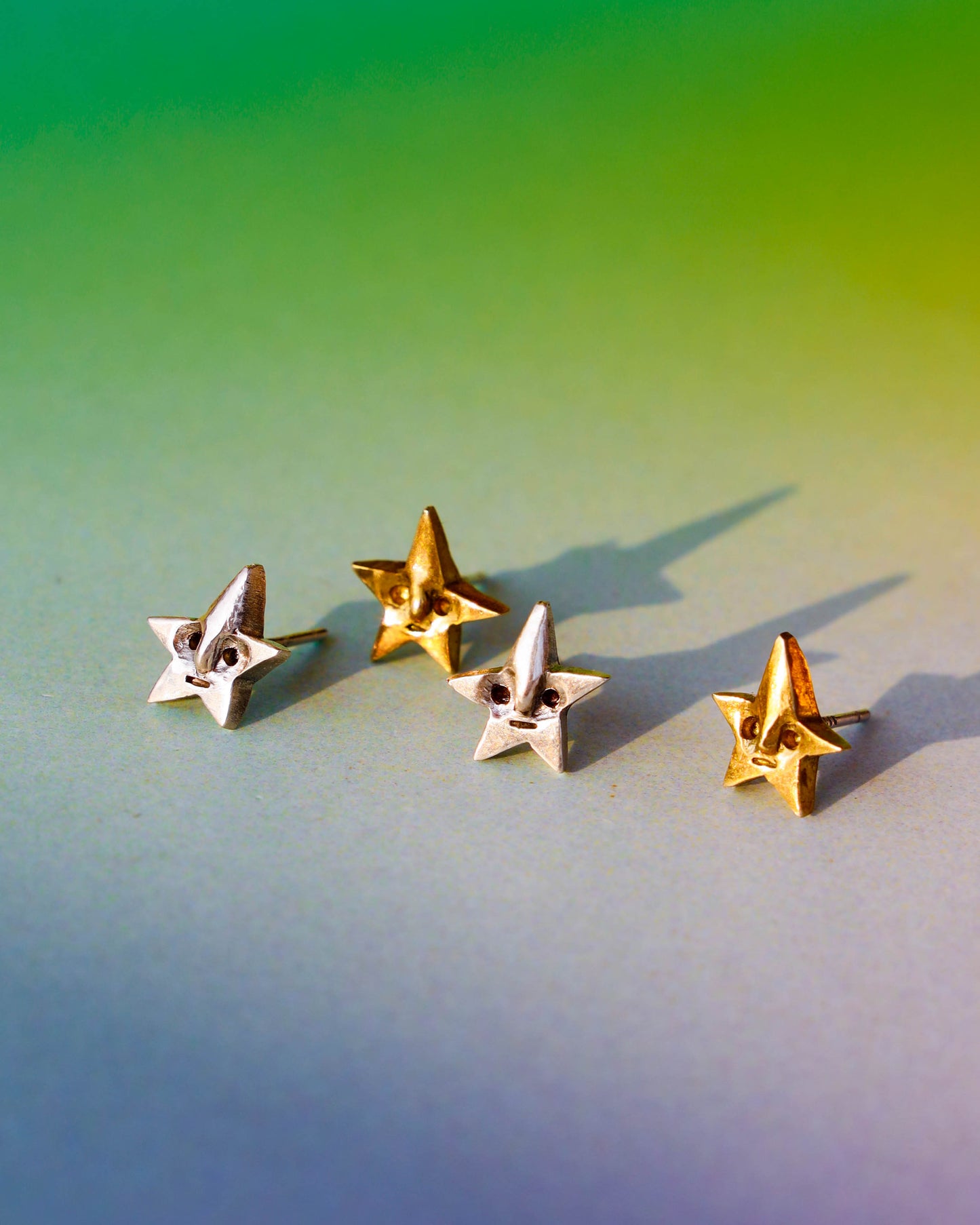 Tiny star face studs earrings, in sterling silver and brass