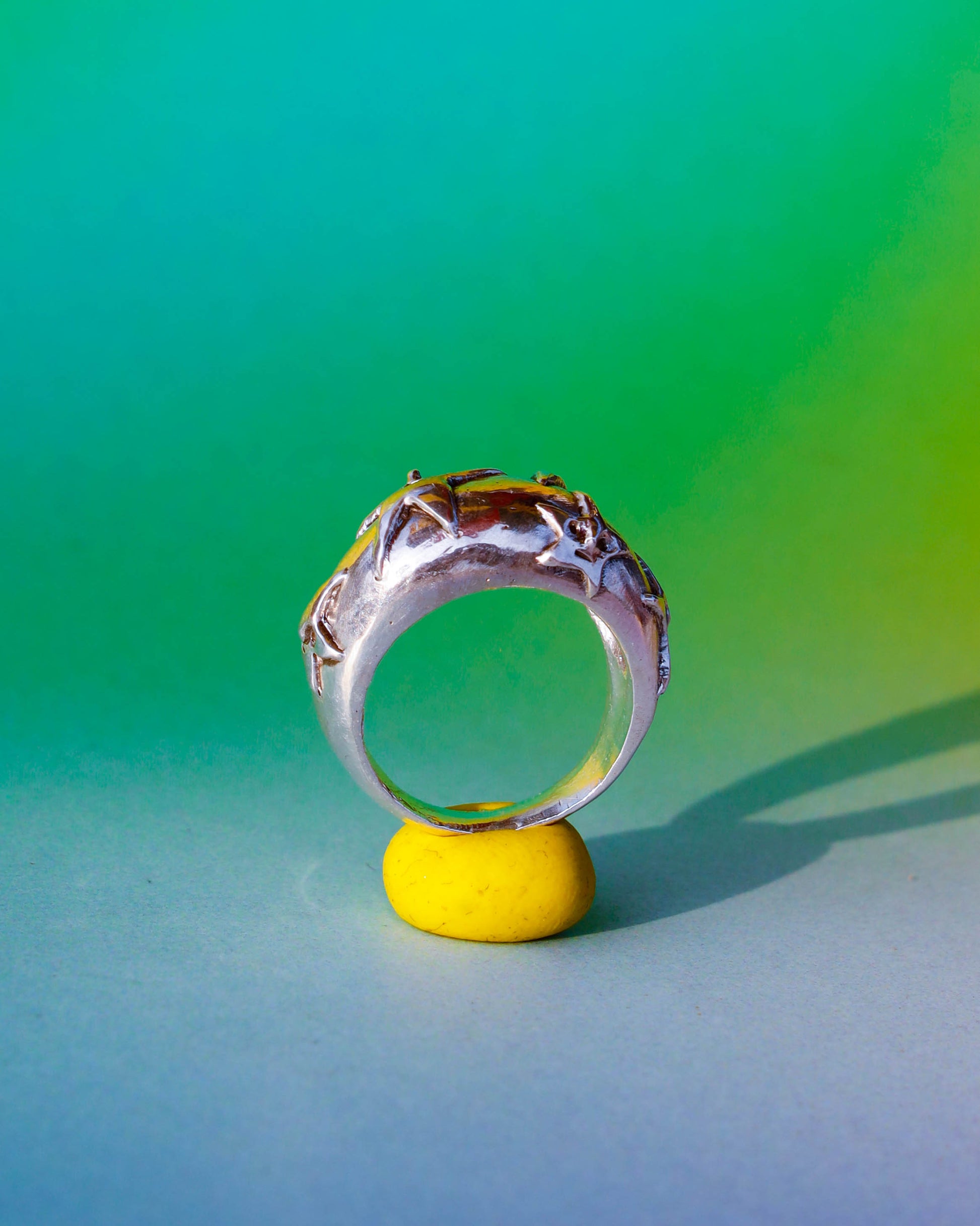 A Puke Of Stars Ring, a solid sterling silver ring with stars design on the signet ring