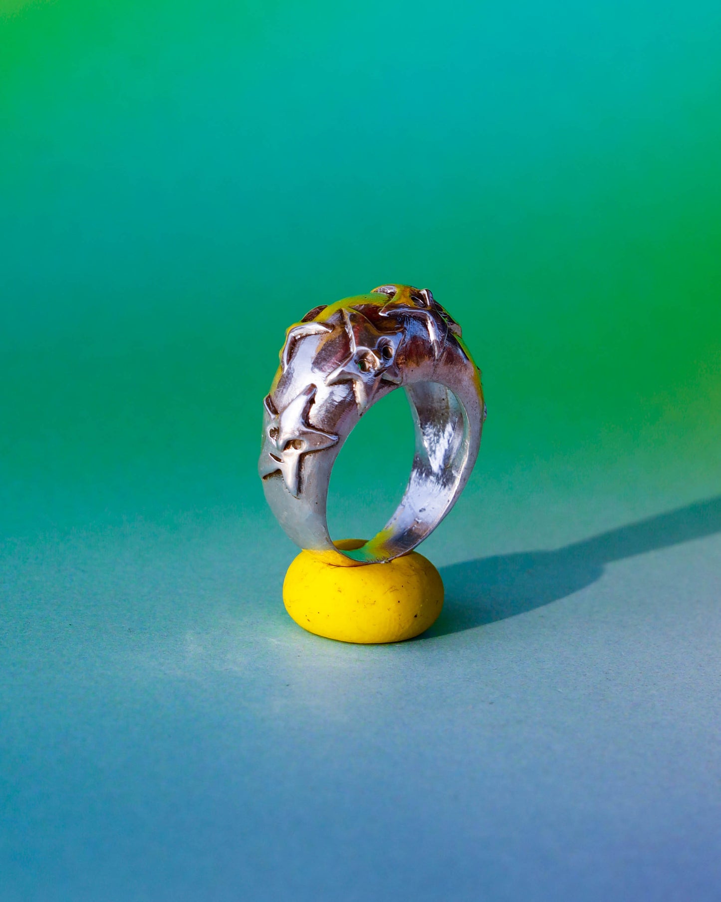 A Puke Of Stars Ring, a solid sterling silver ring with stars design on the signet ring