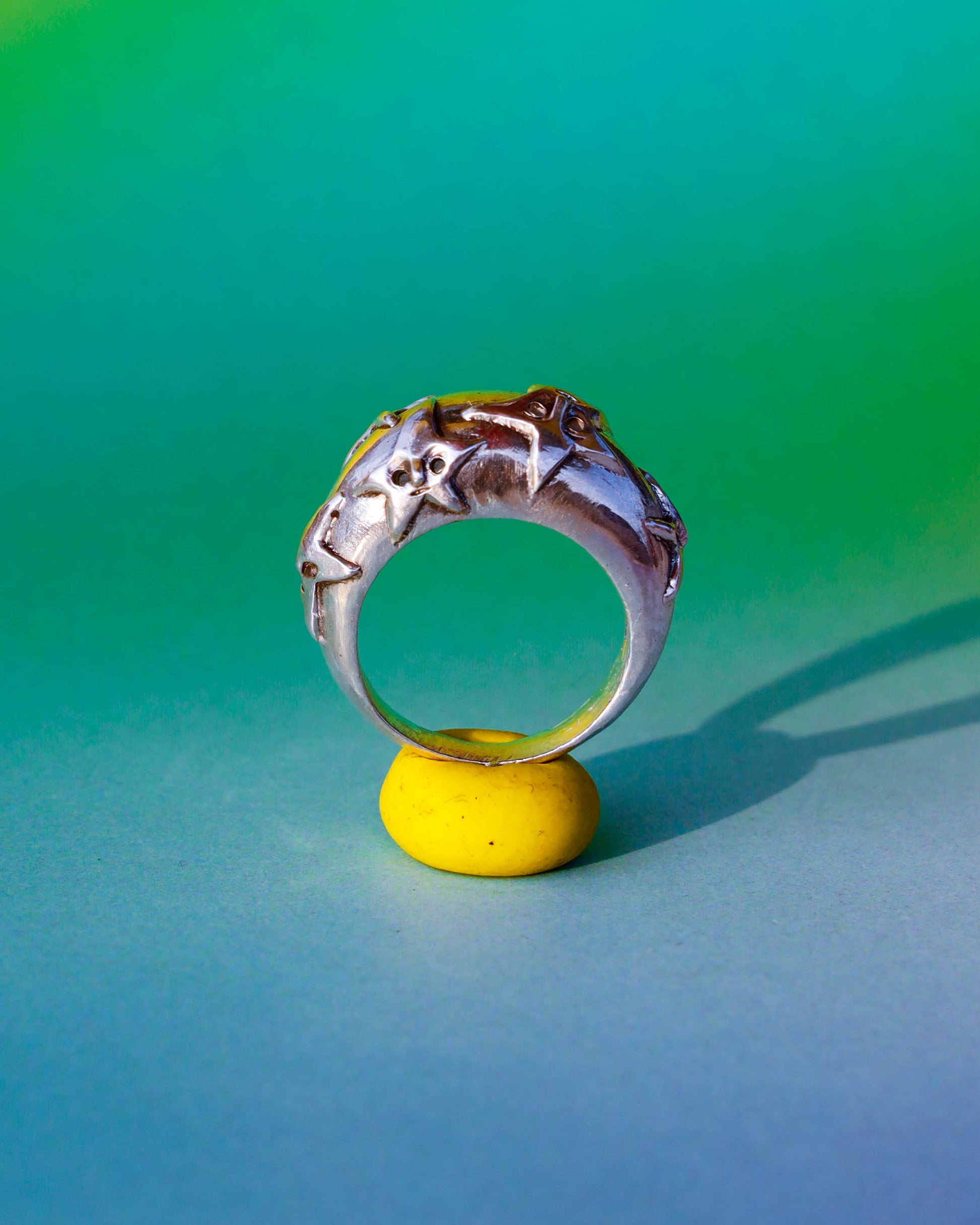 A Puke Of Stars Ring, a solid sterling silver ring with stars design on the signet ring