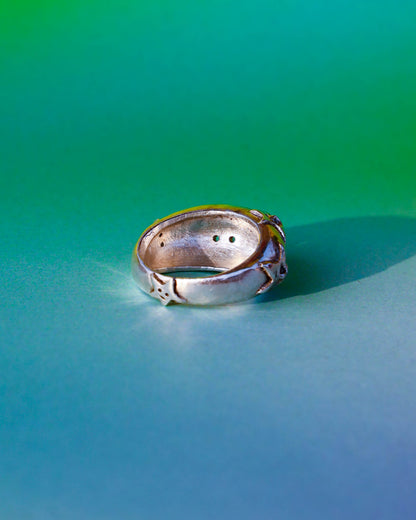 A Puke Of Stars Ring, a solid sterling silver ring with stars design on the signet ring