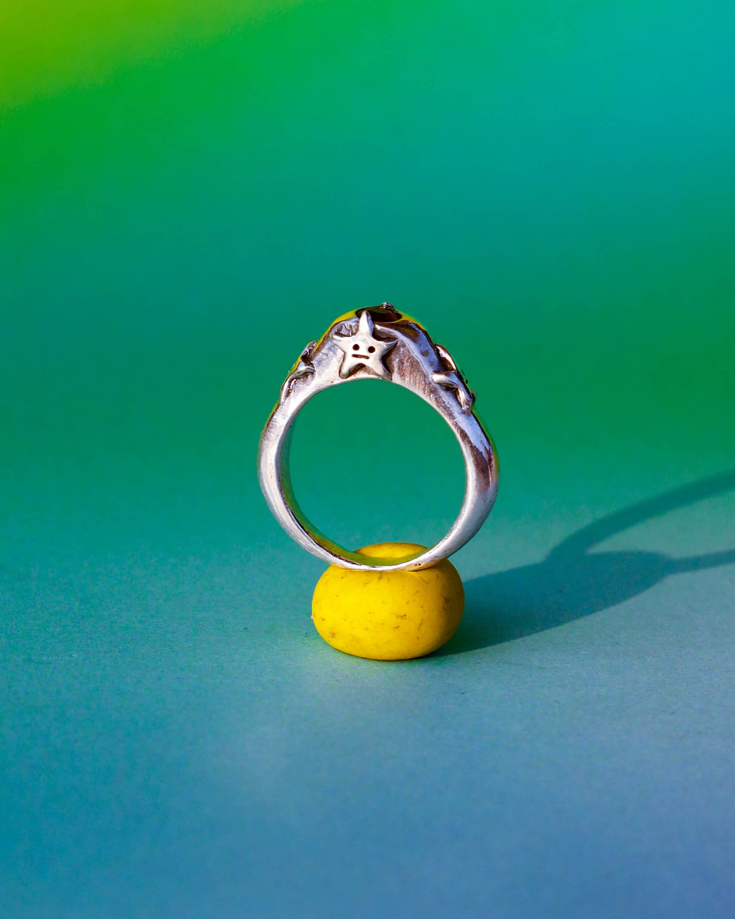 four stars sterling silver ring with a red garnet