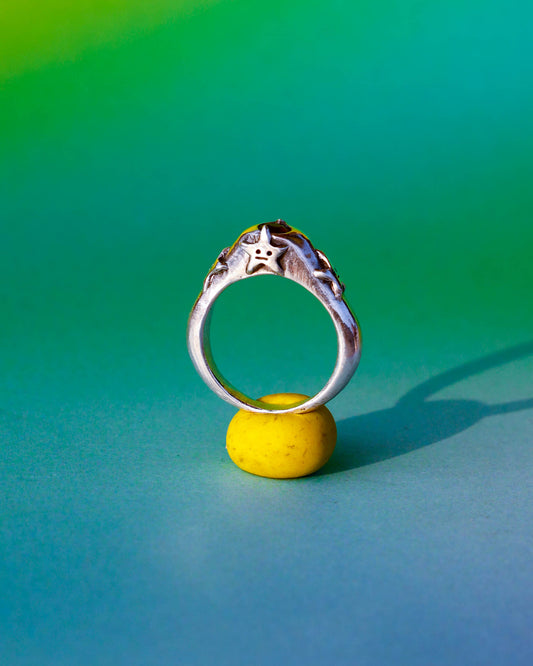 four stars sterling silver ring with a red garnet