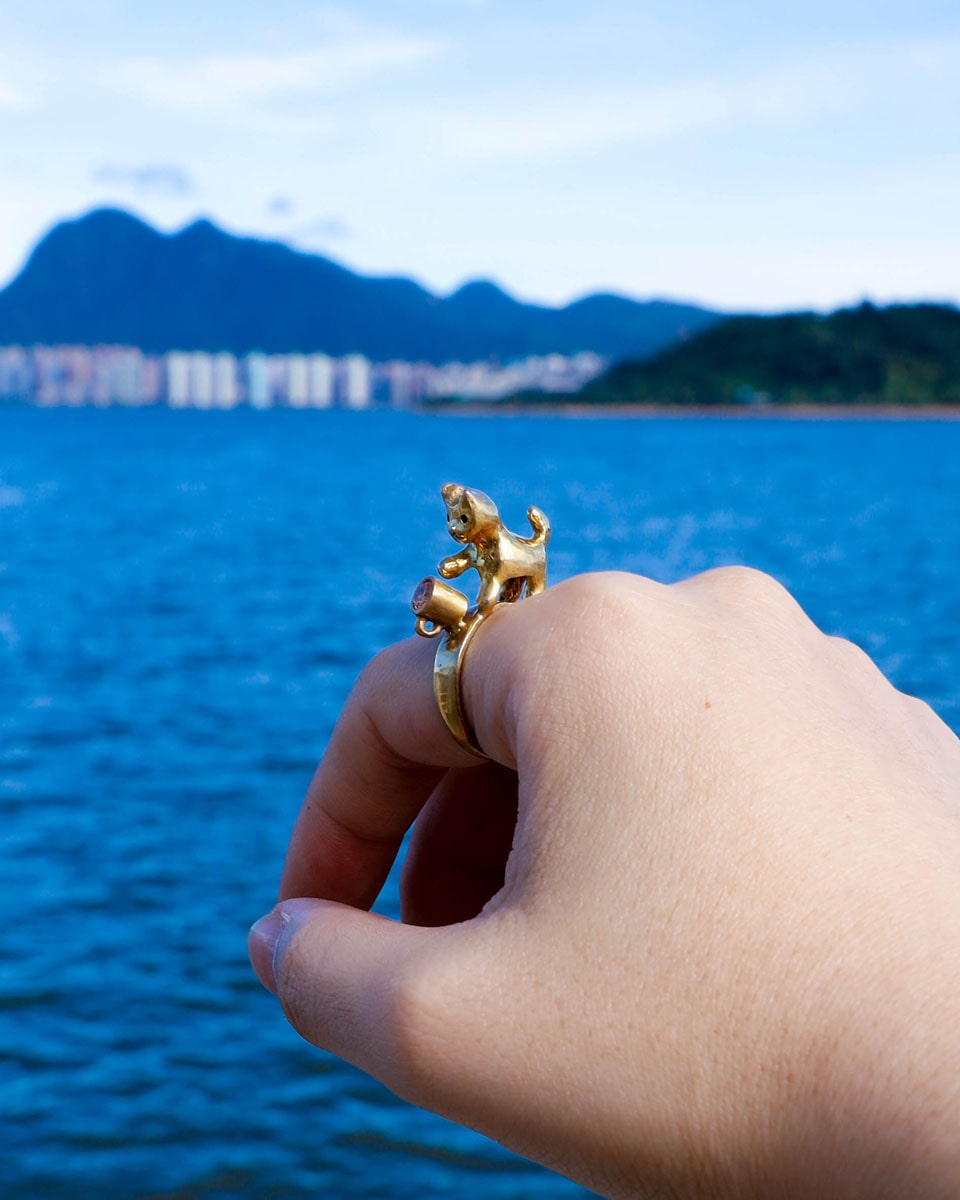 naughty kitty solid brass ring, cat pushing cup off ring band, set with cz stone, handmade jewellery, by fake plastic love