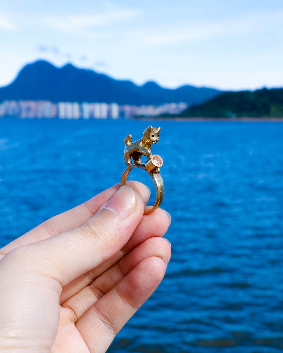 naughty kitty solid brass ring, cat pushing cup off ring band, set with cz stone, handmade jewellery, by fake plastic love