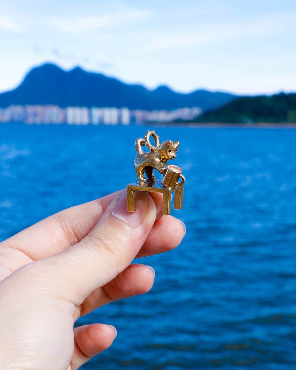 solid brass naughty kitty charm, cat pushing cup off table, set with cz stone, handmade jewellery, by fake plastic love
