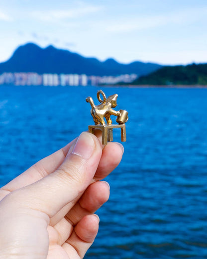 solid brass naughty kitty charm, cat pushing cup off table, set with cz stone, handmade jewellery, by fake plastic love