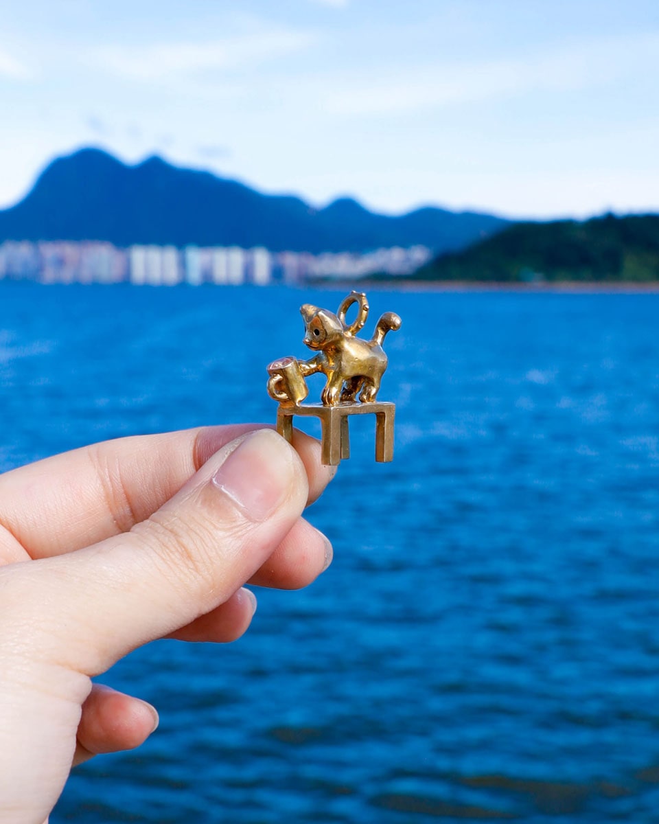 solid brass naughty kitty charm, cat pushing cup off table, set with cz stone, handmade jewellery, by fake plastic love