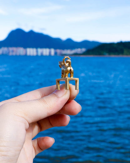 solid brass naughty kitty charm, cat pushing cup off table, set with cz stone, handmade jewellery, by fake plastic love