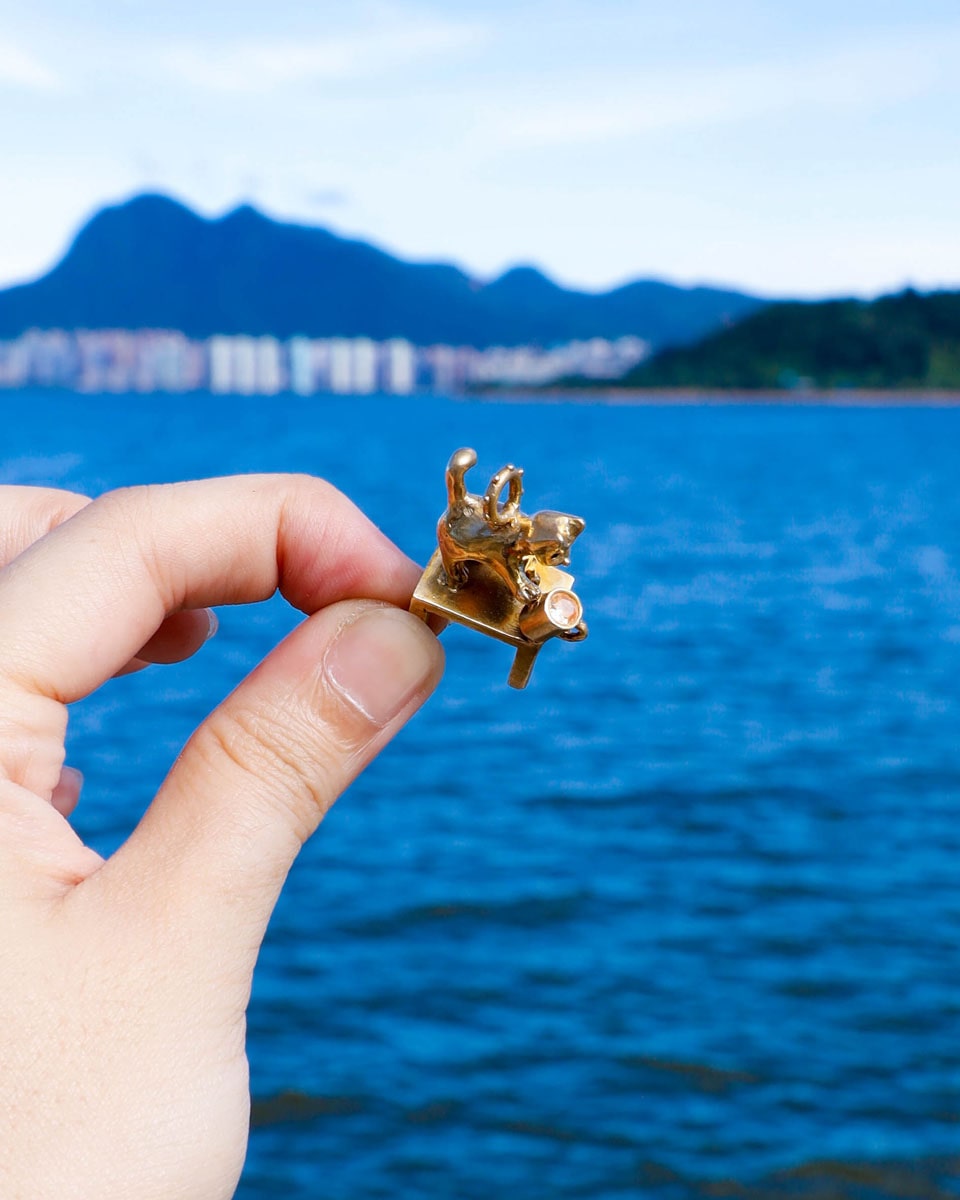 solid brass naughty kitty charm, cat pushing cup off table, set with cz stone, handmade jewellery, by fake plastic love