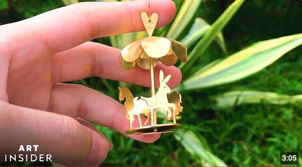 Load video: Fake plastic love handmade carousel earring featured in art insider